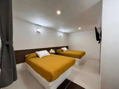 Cama o camas de una habitación en Hotel Quinta Luna Zacatlán