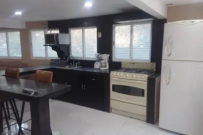 Una cocina o zona de cocina en grupos familiares 2