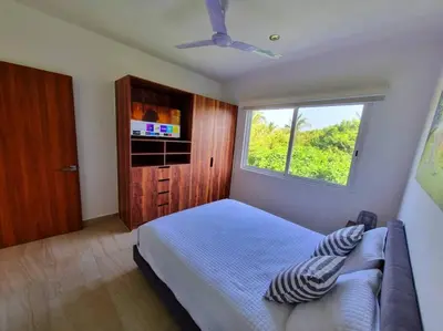 Una televisión o centro de entretenimiento en Depto en Diamante con Club de Playa Privado