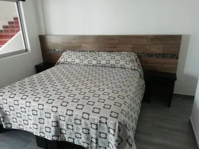 Cama o camas de una habitación en HOTEL QUINTERO