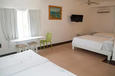 Cama o camas de una habitación en Hotel Olinalá Diamante