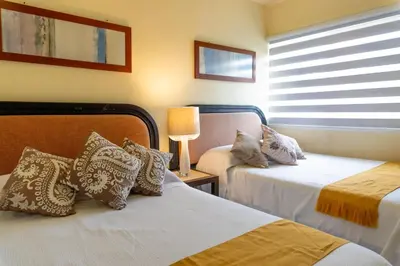Cama o camas de una habitación en Acapulco Great location Pool Gym and Smart TV