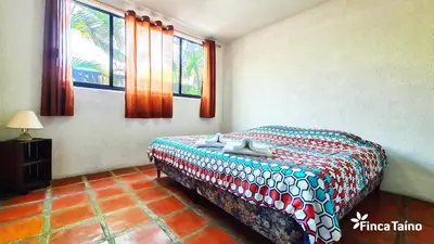 Cama o camas de una habitación en Finca Taino. Hermosa casa con alberca