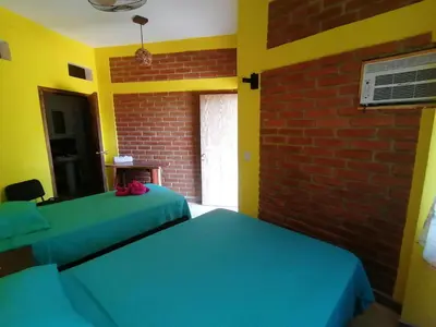 Cama o camas de una habitación en HOTEL AVE FENIX