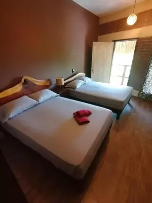 Cama o camas de una habitación en HOTEL AVE FENIX