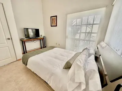 Una televisión o centro de entretenimiento en Acogedora casa en Morelos