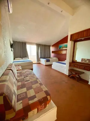 Cama o camas de una habitación en Suites Acapulco Yamba