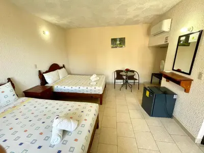 Cama o camas de una habitación en Hotel Bigu
