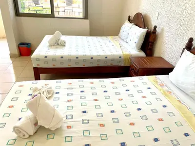 Cama o camas de una habitación en Hotel Bigu