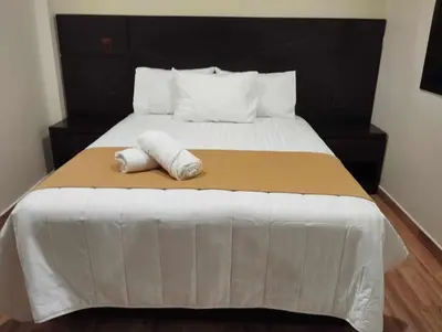 Cama o camas de una habitación en Hotel & Cabañas Malinche