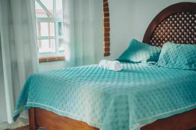 Cama o camas de una habitación en Casa Arcos Tepoztlán