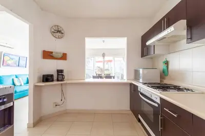 Una cocina o zona de cocina en Acapulco Diamante. Casa de descanso