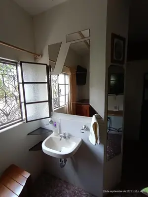 Una televisión o centro de entretenimiento en Hotel Posada Spa Antigua Casa Hogar