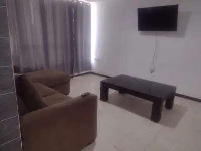 Una televisión o centro de entretenimiento en Amplia Casa centro de Teziutlán