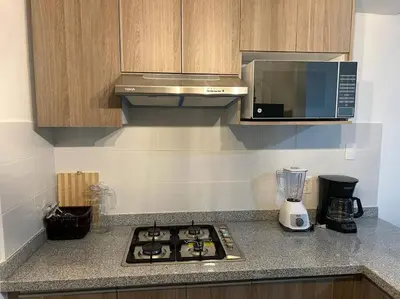 Una cocina o zona de cocina en Departamento con club de playa Acapulco Diamante