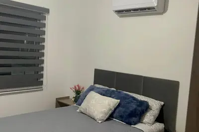 Cama o camas de una habitación en Departamento con club de playa Acapulco Diamante