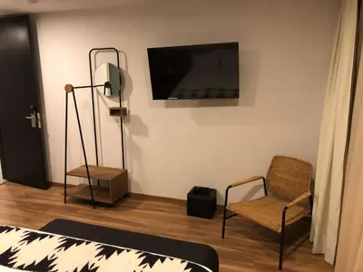 Una televisión o centro de entretenimiento en Casa Tlaxcalli by Beddo Hoteles