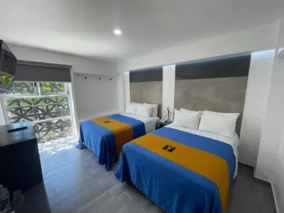 Cama o camas de una habitación en Hotel GALENO