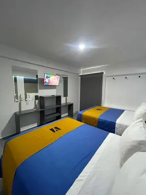 Cama o camas de una habitación en Hotel GALENO