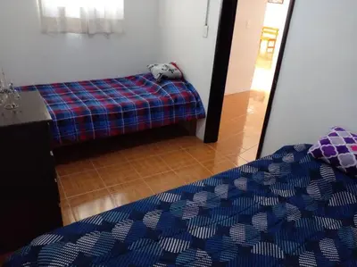 Cama o camas de una habitación en CASA ACOGEDORA