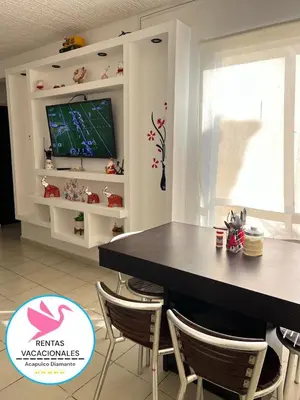 Una televisión o centro de entretenimiento en Depa Acapulco diamante alberca wifi