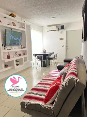 Una televisión o centro de entretenimiento en Depa Acapulco diamante alberca wifi