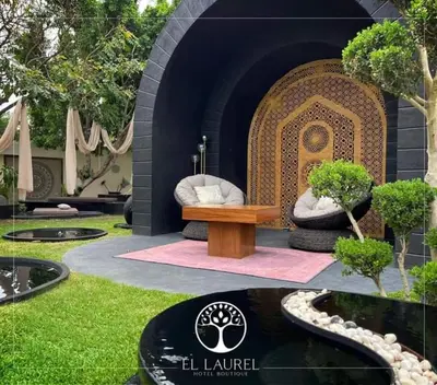 Jardín al aire libre en El Laurel Hotel Boutique