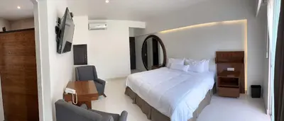 Cama o camas de una habitación en El Laurel Hotel Boutique