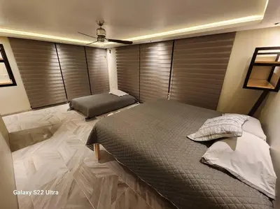 Cama o camas de una habitación en Casa Beily con alberca climatizada