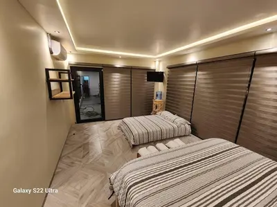 Cama o camas de una habitación en Casa Beily con alberca climatizada