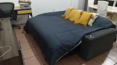Una televisión o centro de entretenimiento en Casa Vacacional La Arcada
