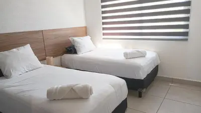 Cama o camas de una habitación en Acapulco diamante, club de playa privado, canchas pádel para 8 huéspedes