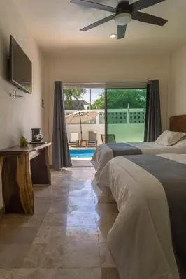 Cama o camas de una habitación en PETRAS HOTEL