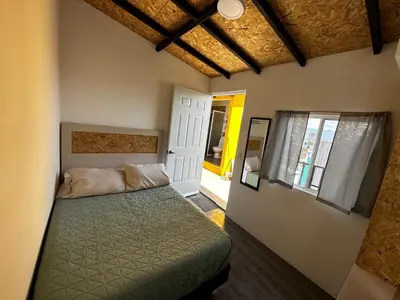 Cama o camas de una habitación en CASA MARIN Jacaranda