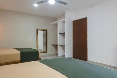 Cama o camas de una habitación en Casa Origen Huatulco