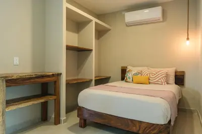 Cama o camas de una habitación en Casa Origen Huatulco