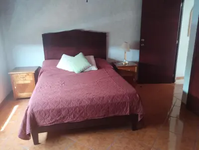 Cama o camas de una habitación en Casa Colibrí Ahuatepec Cuernavaca