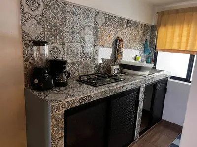 Una cocina o zona de cocina en Departamento de Cantera