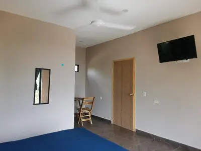 Una televisión o centro de entretenimiento en CASA EBANO
