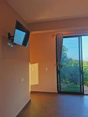 Una televisión o centro de entretenimiento en CASA EBANO