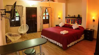 Cama o camas de una habitación en Oasis Maya