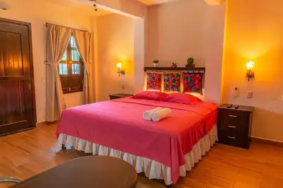 Cama o camas de una habitación en Oasis Maya