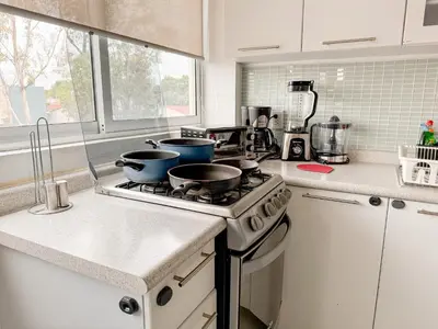 Una cocina o zona de cocina en Beautiful Apartment, Airport, Downtown, Foro Sol