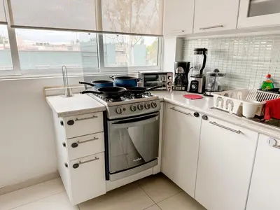 Una cocina o zona de cocina en Beautiful Apartment, Airport, Downtown, Foro Sol