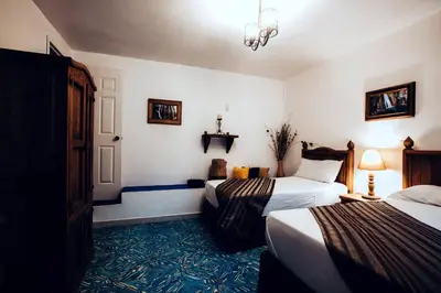 Cama o camas de una habitación en Hostal Plaza Central