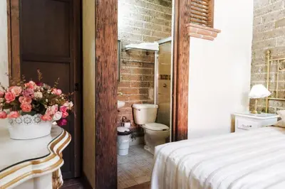 Cama o camas de una habitación en Hotel Na-anché Aeropuerto