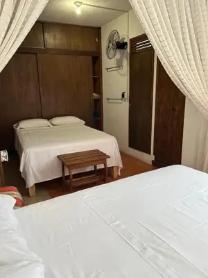 Cama o camas de una habitación en Hotel Na-anché Aeropuerto