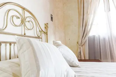 Cama o camas de una habitación en Hotel Na-anché Aeropuerto