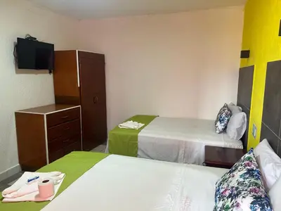 Cama o camas de una habitación en Hotel Capri Playa a una calle de la Playa Regatas