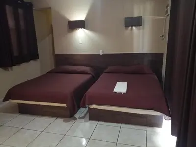 Cama o camas de una habitación en Hotel Delfines Del Mar